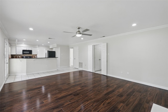 1951 Pin Oak Dr, Flower Mound, TX 75028 - unfurnished living room with light wood-style flooring, a ceiling fan, baseboards, recessed lighting, and crown molding