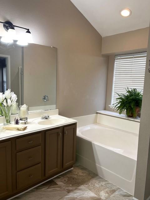518 Lonestar Park Ln, Ponder, TX 76259 - full bathroom featuring a garden tub, vanity, and a stall shower