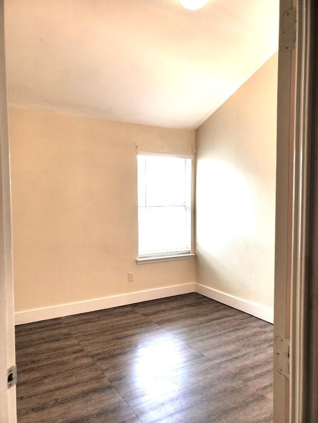 518 Lonestar Park Ln, Ponder, TX 76259 - spare room with baseboards and dark wood-type flooring