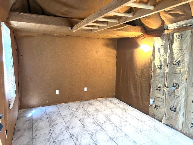518 Lonestar Park Ln, Ponder, TX 76259 - spare room with cooling unit, electric panel, and marble finish floor