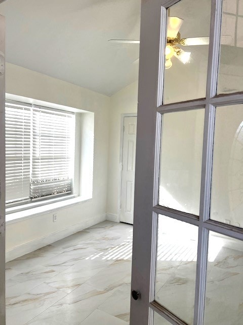 518 Lonestar Park Ln, Ponder, TX 76259 - spare room featuring baseboards, vaulted ceiling, and marble finish floor
