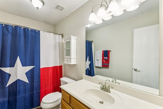 bathroom featuring a textured ceiling, vanity, curtained shower, toilet, and visible vents