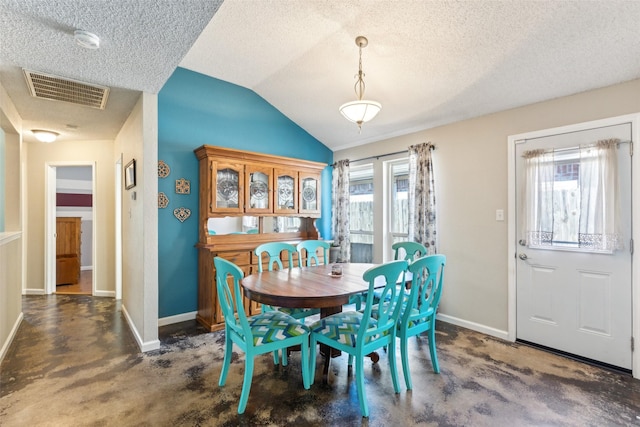 carpeted dining room with vaulted ceiling, visible vents, and baseboards