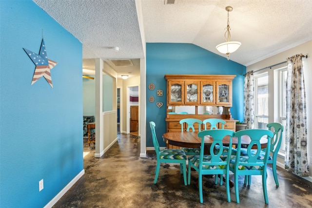 dining room with visible vents, vaulted ceiling, baseboards, and a textured ceiling