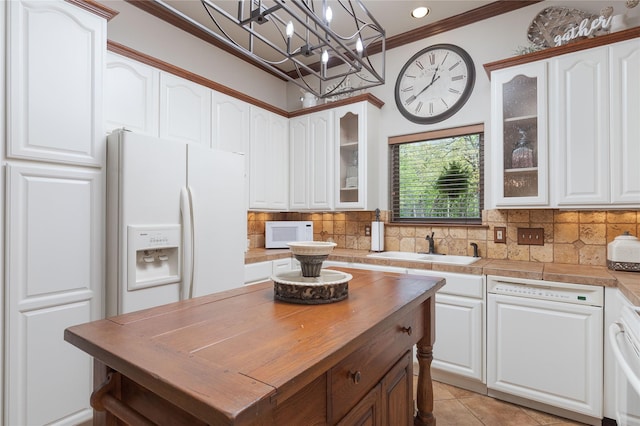 10248 N Poetry Ln, Terrell, TX 75160 - kitchen featuring ornamental molding, white cabinets, white appliances, and butcher block countertops