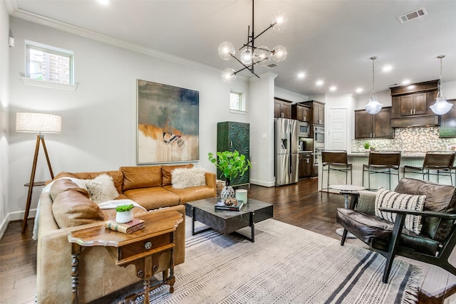 living room with dark wood-type flooring, visible vents, crown molding, and a healthy amount of sunlight