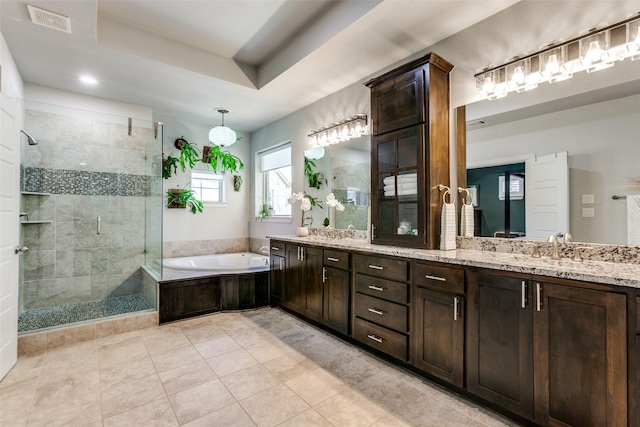 full bathroom with a bath, tiled shower, tile patterned flooring, a sink, and double vanity