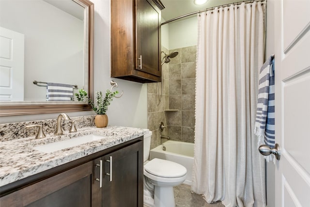 full bathroom featuring shower / bath combo with shower curtain, vanity, and toilet