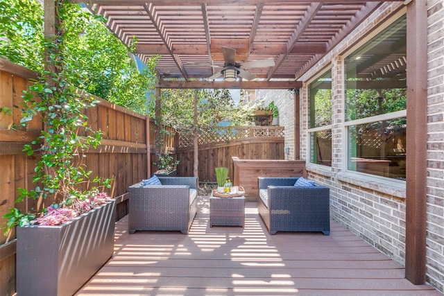 wooden deck featuring a pergola, an outdoor living space, a fenced backyard, and ceiling fan