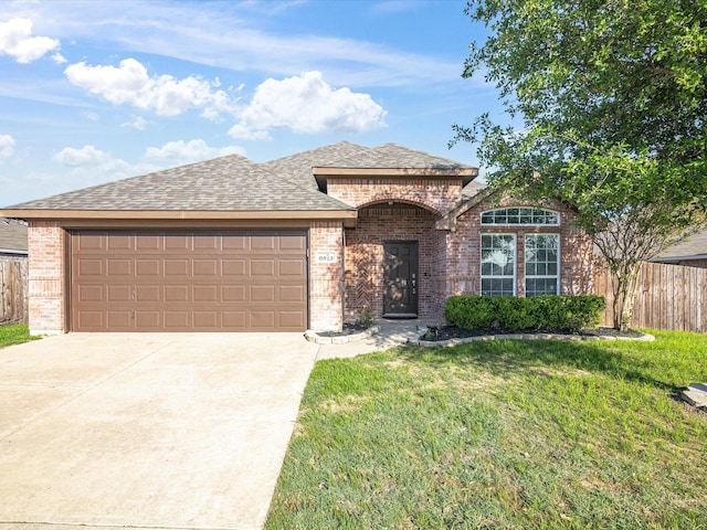 6813 Falconer Way, Fort Worth, TX 76179 - french country home featuring brick siding, an attached garage, driveway, and roof with shingles