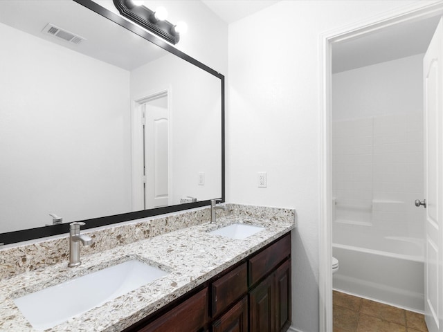 6813 Falconer Way, Fort Worth, TX 76179 - bathroom featuring double vanity, tile patterned floors, and toilet