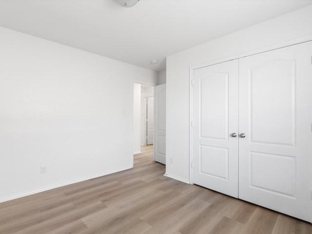 6813 Falconer Way, Fort Worth, TX 76179 - unfurnished bedroom featuring light wood finished floors, baseboards, and a closet