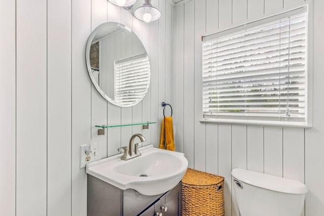 bathroom featuring toilet and vanity