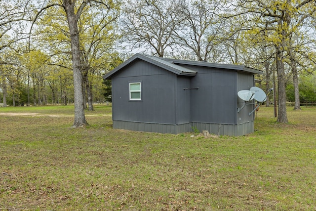 view of property exterior featuring a lawn
