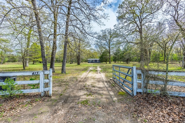 view of gate featuring fence