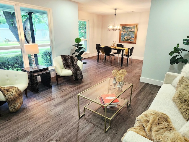 5515 Enchanted Ln, Dallas, TX 75227 - living room with baseboards, a chandelier, dark wood-style flooring, and plenty of natural light