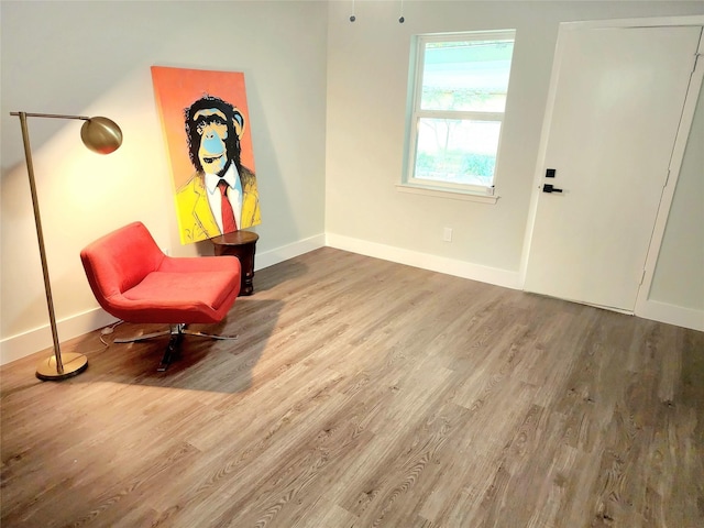 5515 Enchanted Ln, Dallas, TX 75227 - living area featuring wood finished floors and baseboards