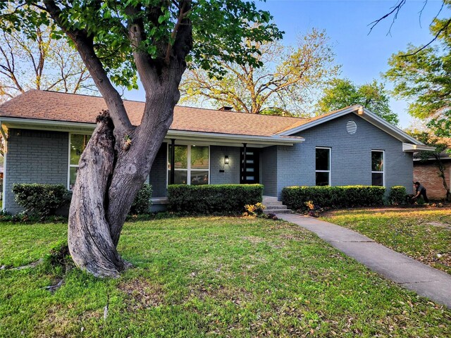 5515 Enchanted Ln, Dallas, TX 75227 - mid-century inspired home featuring brick siding and a front lawn
