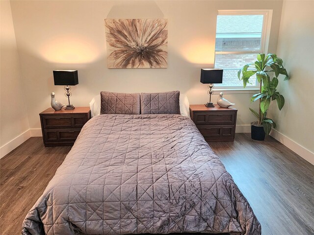 5515 Enchanted Ln, Dallas, TX 75227 - bedroom featuring wood finished floors and baseboards