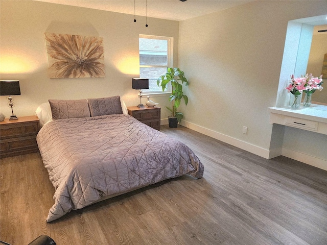 5515 Enchanted Ln, Dallas, TX 75227 - bedroom with wood finished floors and baseboards