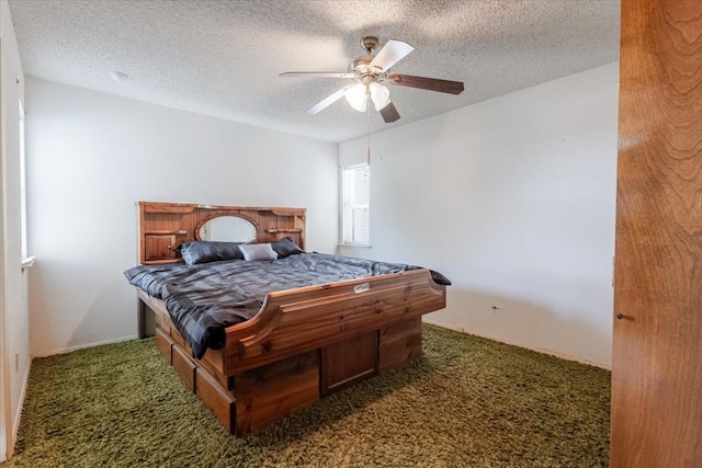 carpeted bedroom featuring ceiling fan and a textured ceiling