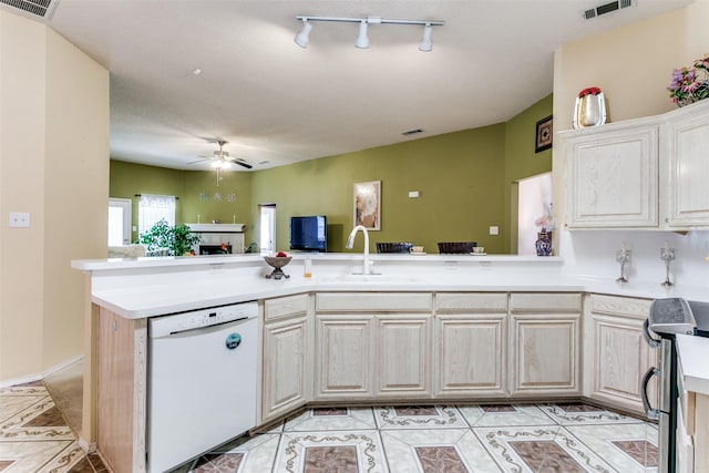 kitchen with open floor plan, a ceiling fan, visible vents, white dishwasher, and a sink