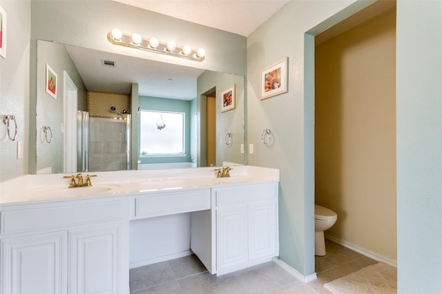 full bath with tile patterned floors, visible vents, a sink, and a stall shower