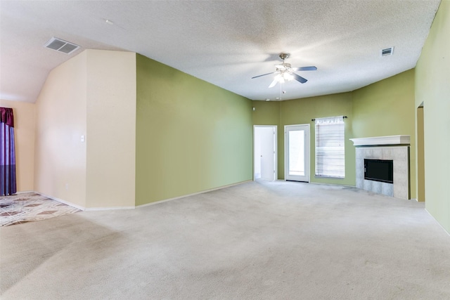 3012 Silent Creek Trl, Fort Worth, TX 76053 - unfurnished living room with carpet floors, ceiling fan, a tile fireplace, and a textured ceiling