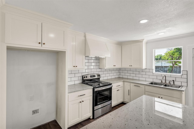 4343 Birch Dr, Mesquite, TX 75150 - kitchen featuring stainless steel range with electric stovetop, tasteful backsplash, dark wood-type flooring, light stone counters, and a textured ceiling