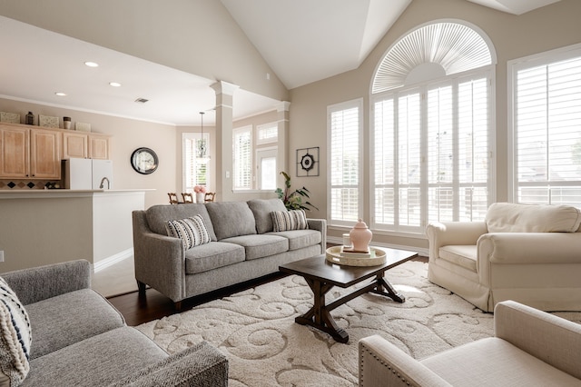 living room featuring recessed lighting, vaulted ceiling, wood finished floors, visible vents, and baseboards