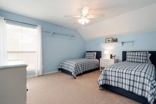 carpeted bedroom featuring vaulted ceiling, baseboards, ceiling fan, and multiple windows