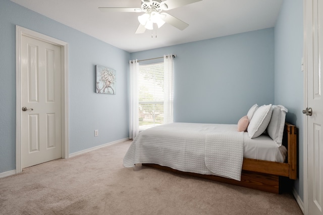 bedroom featuring carpet, baseboards, and ceiling fan
