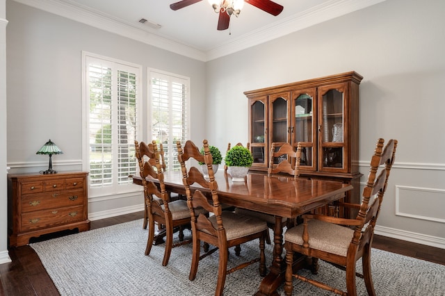 dining room featuring a healthy amount of sunlight, ornamental molding, ceiling fan, and visible vents