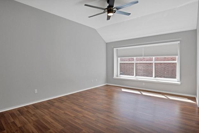 9409 Stonewood Dr, Mckinney, TX 75072 - empty room with vaulted ceiling, dark wood-type flooring, a ceiling fan, and baseboards