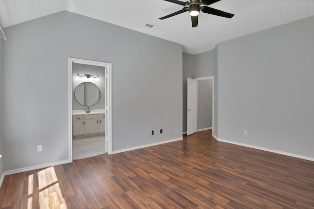 9409 Stonewood Dr, Mckinney, TX 75072 - unfurnished bedroom with wood finished floors, baseboards, vaulted ceiling, ensuite bathroom, and a ceiling fan