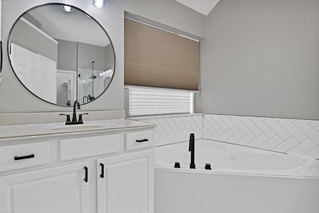 9409 Stonewood Dr, Mckinney, TX 75072 - full bathroom with a bath, vanity, and walk in shower