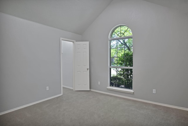 9409 Stonewood Dr, Mckinney, TX 75072 - carpeted spare room with vaulted ceiling and baseboards