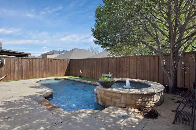 9409 Stonewood Dr, Mckinney, TX 75072 - view of pool with a fenced backyard, a pool with connected hot tub, and a patio area