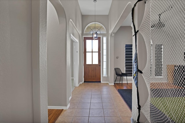 9409 Stonewood Dr, Mckinney, TX 75072 - tiled entryway featuring baseboards