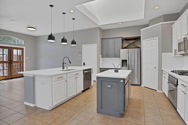 9409 Stonewood Dr, Mckinney, TX 75072 - kitchen featuring an island with sink, appliances with stainless steel finishes, a sink, light tile patterned floors, and recessed lighting