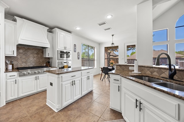 4504 Oxbow Dr, Mckinney, TX 75072 - kitchen featuring a sink, stainless steel appliances, custom exhaust hood, backsplash, and recessed lighting