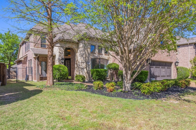 4504 Oxbow Dr, Mckinney, TX 75072 - view of front of house with brick siding, a gate, and a garage