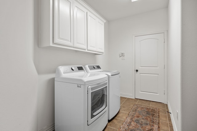 4504 Oxbow Dr, Mckinney, TX 75072 - clothes washing area with independent washer and dryer, cabinet space, dark tile patterned flooring, and baseboards
