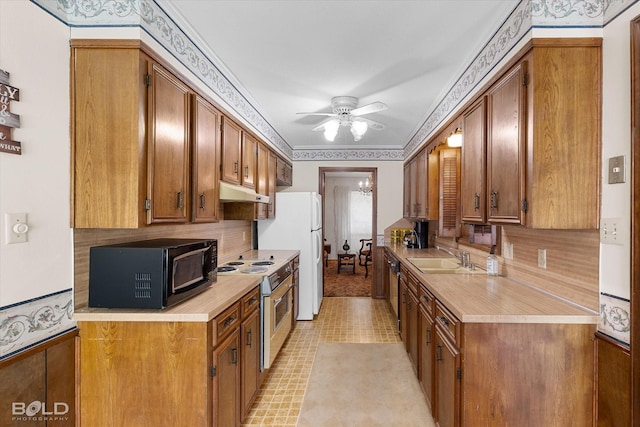6307 Bocage Dr, Shreveport, LA 71119 - kitchen featuring under cabinet range hood, white appliances, light countertops, and a sink
