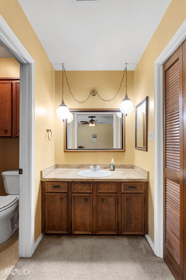 6307 Bocage Dr, Shreveport, LA 71119 - bathroom featuring vanity, baseboards, a ceiling fan, and toilet