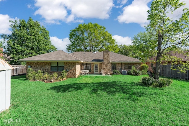 6307 Bocage Dr, Shreveport, LA 71119 - view of front facade featuring a front yard, fence, brick siding, and central AC