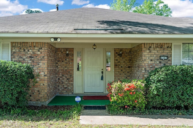 6307 Bocage Dr, Shreveport, LA 71119 - property entrance with brick siding and roof with shingles