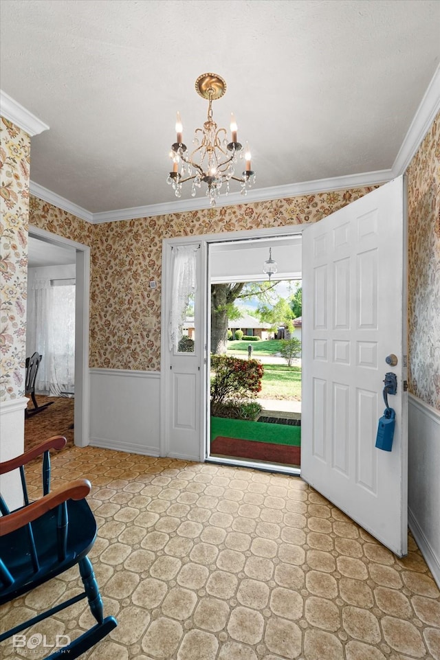 6307 Bocage Dr, Shreveport, LA 71119 - entryway with wallpapered walls, an inviting chandelier, a wainscoted wall, and a healthy amount of sunlight