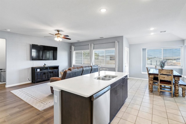 kitchen featuring a healthy amount of sunlight, dishwasher, a sink, and visible vents