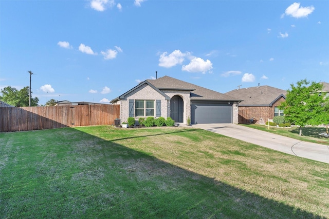 ranch-style house with a garage, fence, a front lawn, brick siding, and concrete driveway